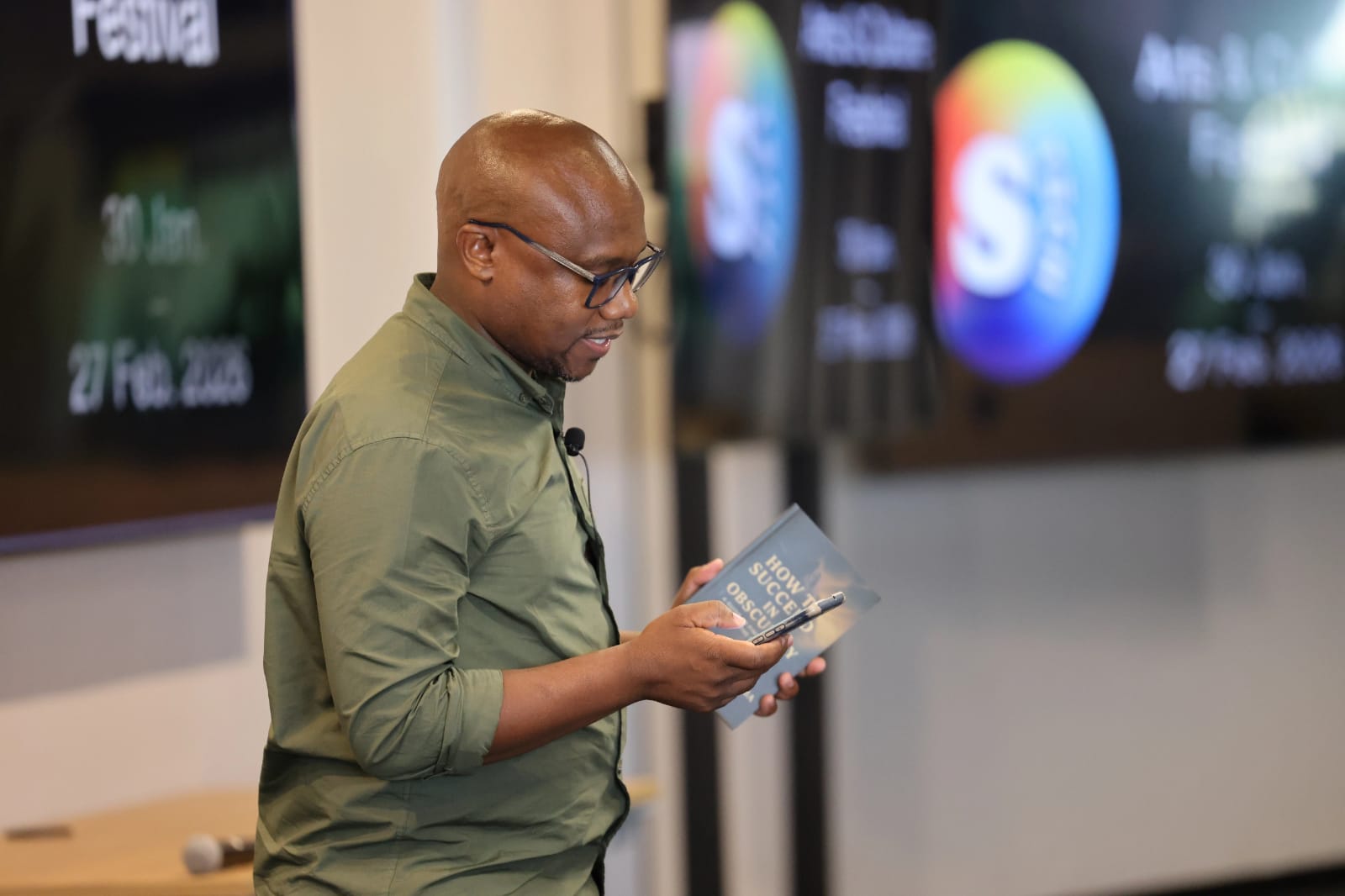 Johannes Mothiba holding How To Succeed in Obscurity